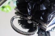 Black Silk Flower and Blue Handbag