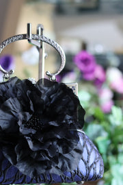Black Silk Flower and Blue Handbag