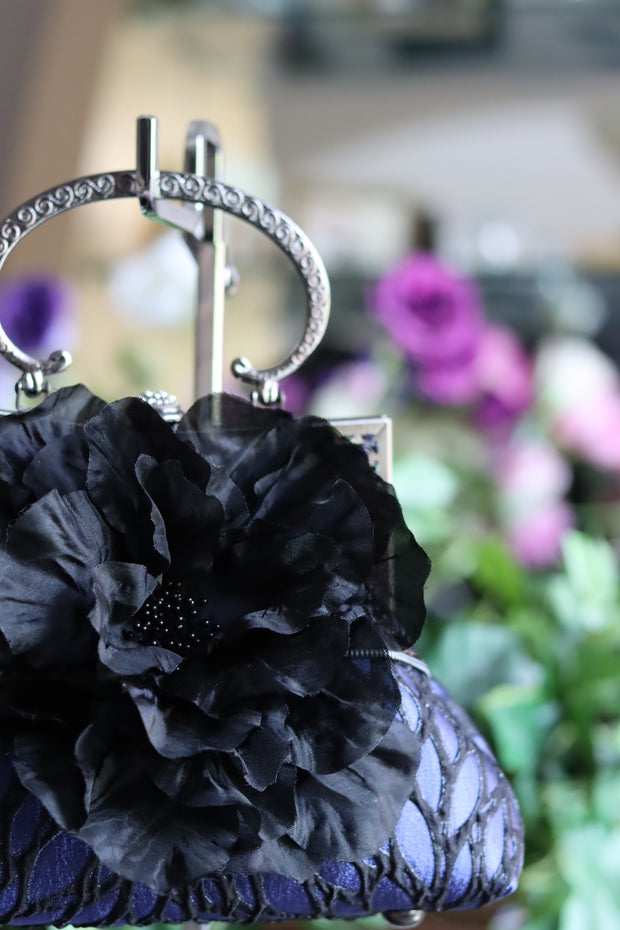 Black Silk Flower and Blue Handbag