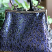 Black Silk Flower and Blue Handbag